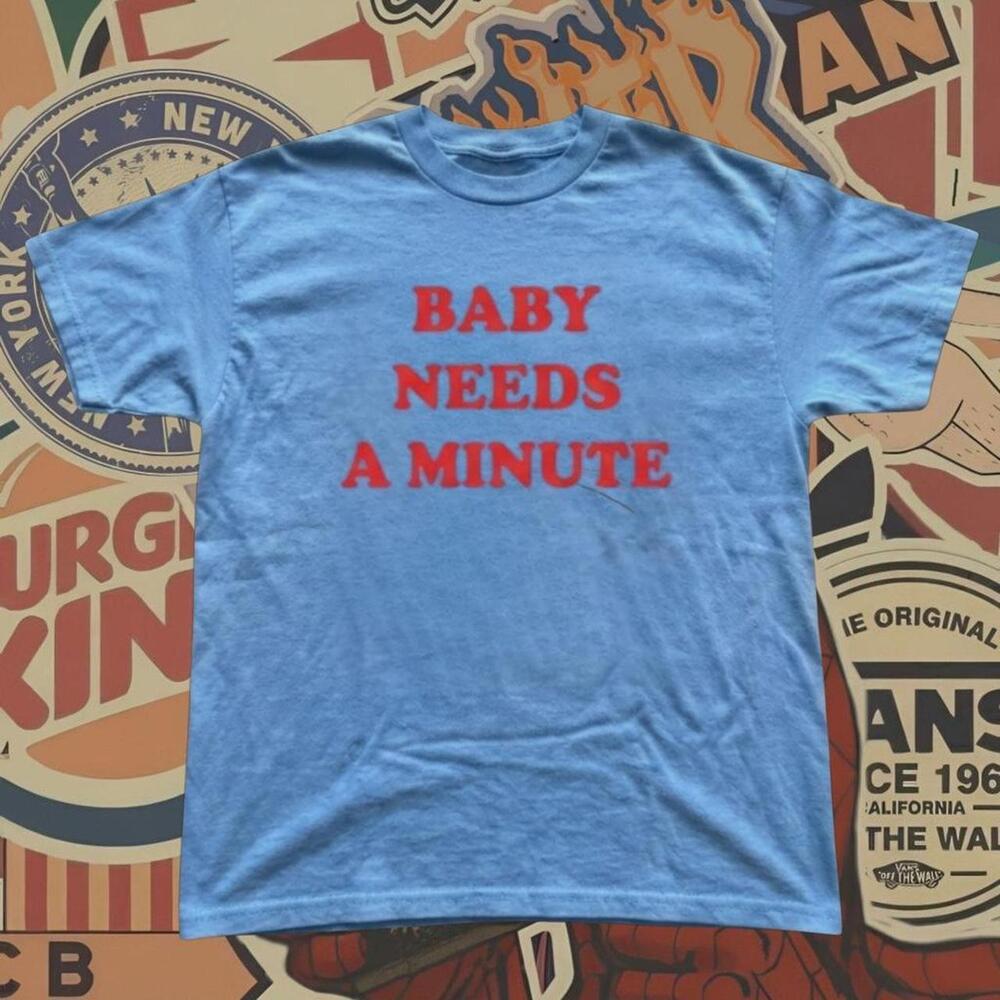 Baby Needs A Minute Tee With Red Text Reading _Baby Needs A Minute